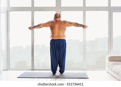 Fat Guy Doing Exercise In Morning