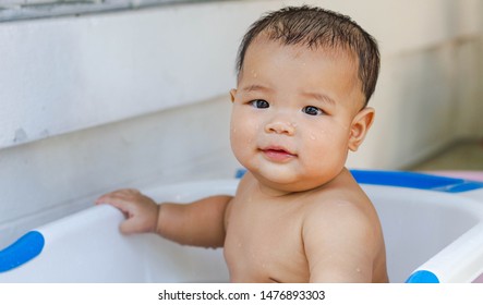 Fat Kid Is Bathing Happily With His Mother