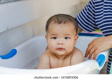 Fat Kid Is Bathing Happily With His Mother