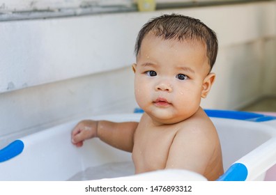 Fat Kid Is Bathing Happily With His Mother