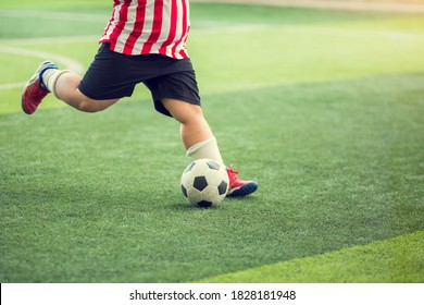 Fat Kid Soccer Player Run To Shoot Ball To Goal On Artificial Turf. Soccer Player Training For Football Match.