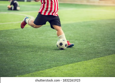 Fat Kid Soccer Player Run To Shoot Ball To Goal On Artificial Turf. Soccer Player Training For Football Match.