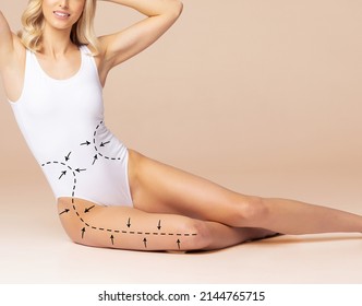 Fat lose, liposuction, sport, fitness, healthy eating, nutrition, fit shape and cellulite removal. Woman with arrows on her body. - Shutterstock ID 2144765715