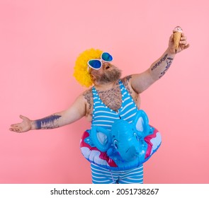 Fat man with beard and wig eats an icecream