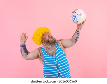 Fat man with beard and wig play with the ball