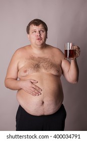 A Fat Man With A Beer Mug In Hand