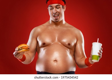 Fat Man With Burger And Soda. Not Sporty Men Drinking And Eating Hamburger Isolated On Red Background.