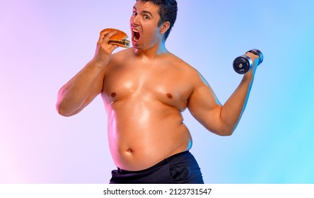 Fat Man Chooses Between Burger And Fitness With Dumbbells. Not Sporty Men Eating Hamburger Isolated On Pink Background.