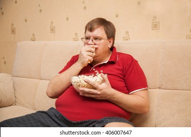 fat man eating popcorn库存照片406007644 shutterstock