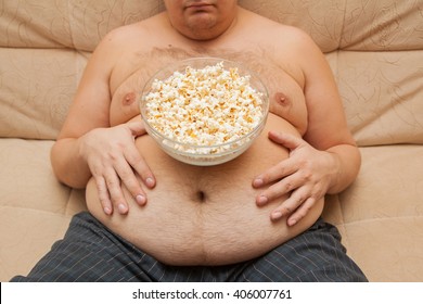 fat-man-eating-popcorn-260nw-406007761.jpg