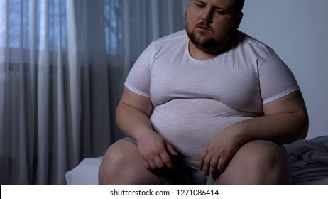 Fat Man Feels Heaviness And Pain In Stomach, Abdominal Bloating, Indigestion