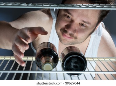 Fat Man Gets Beer From The Fridge