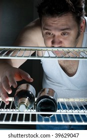 Fat Man Gets Beer From The Fridge