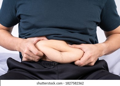 Fat Man Holding Excessive Fat Belly, Overweight Fatty Belly. Diet Lifestyle, Weight Loss, Stomach Muscle, Healthy Concept.