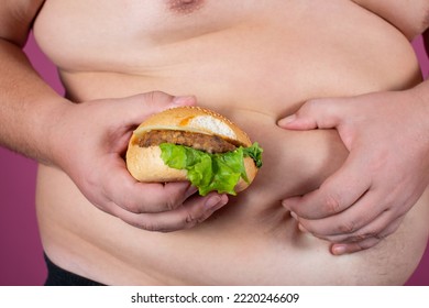 A Fat Man Holds His Stomach. Male Waist. Diet And Weight Loss. Obesity.