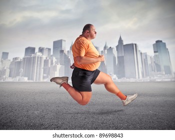 Fat man jogging with cityscape in the background