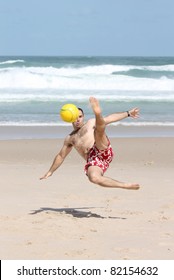 A Fat Man Playing With A Ball On The Beach