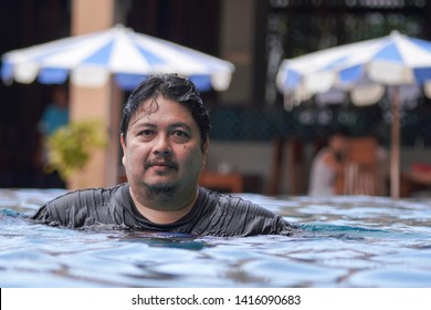 Fat Man Portrait At The Pool.