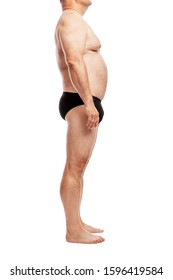 Fat man in shorts. Side view. Full height. Isolated over white background. Vertical. Side view.