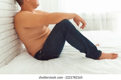 A Fat Man Sits With Fat Folds On His Stomach