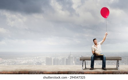 Fat man sitting on bench with book and balloon in hand - Powered by Shutterstock