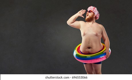 Fat man in a swimming trunks, an inflatable circle, screams.