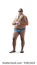 Fat man in swimsuit holding a beach towel