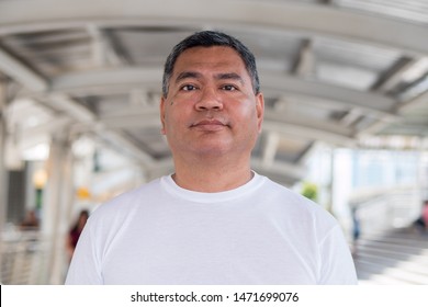 Fat Old Asian Man In City Environment