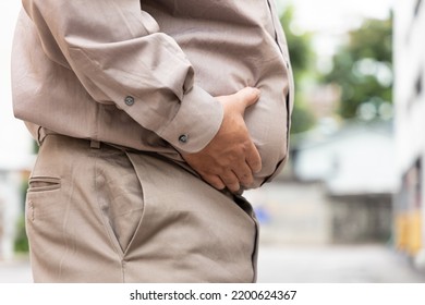 fat old senior man belly, concept of overweight, over eating, obesity, unhealthy lifestyle - Shutterstock ID 2200624367