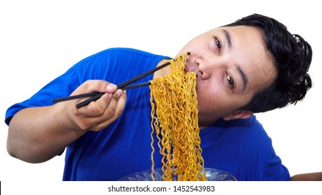 Fat Or Overweight Asian Man Eat A Lot Of Instant Noodles Or Pasta With Chopsticks Isolated In White