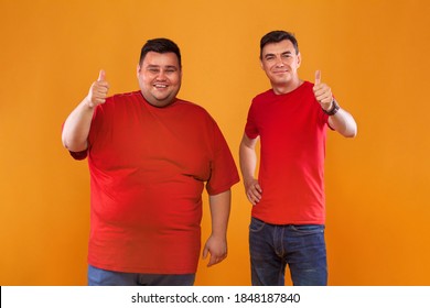 Fat and thin guys in red t-shirt. Two men with different complexion isolated on a yellow background. Ectomorph and endomorph