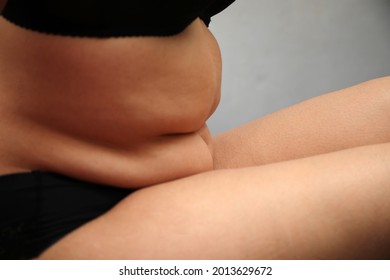 Fat Woman Checking And Pinching Excess Fat On Her Hips