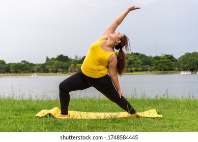 fat woman do yoga , asian Thailand