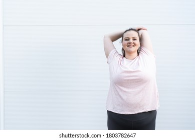 Fat woman doing stretching exercise  - Shutterstock ID 1803782647
