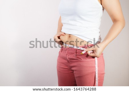 Fat woman, Fat girl, Fat belly, Chubby, Overweight fatty belly of woman isolated on white background, Woman diet lifestyle concept to reduce belly and shape up healthy stomach muscle.