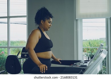 Fat Woman Losing Weight Running On A Treadmill At The Gym                  