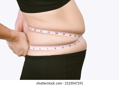 Fat Woman Measuring Her Belly Fat, Overweight Woman Check Out Her Obesity, Woman Muffin Top Waistline.