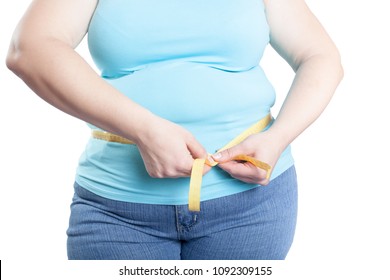 Fat Woman Measuring Her Stomach (overweight, Obesity). Isolated On White Background.