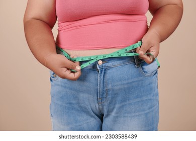 https://image.shutterstock.com/image-photo/fat-woman-measuring-her-stomach-260nw-2303588439.jpg