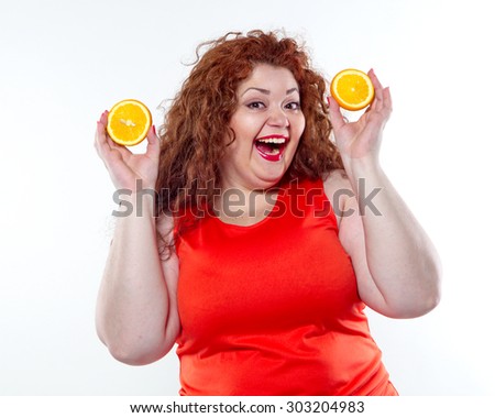 The fat woman with orange juice vegetable fruit holding isolated on the white background