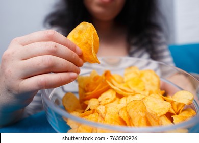 Fat Woman Reaching To Chips. Unhealthy Eating, Bad Habits, Food Addiction, Junk Food Concept