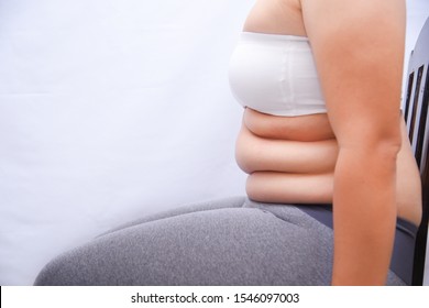 Fat woman sitting in a chair See belly fat Want to lose weight