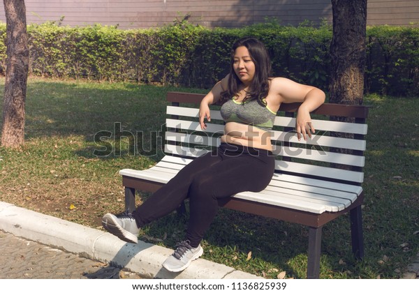 Fat Woman Sitting On Chair Relaxing Royalty Free Stock Image