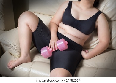 Fat Woman Tired Give Up Exercise Concept Hand Drop Dumbbell Sitting On Sofa