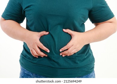 fat women with big belly have stomach pain risk of colon cancer esophageal cancer and stomach cancer, fatty liver, diabetes, high blood pressure angina Hyperlipidemia. dangers of obesity