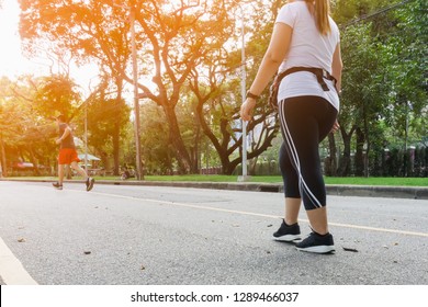 Fat Women Or Senior Woman Legs Walking Exercise At Public Park . Selective Focus