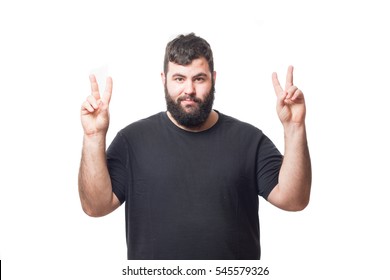 
Fat young man making a victory gesture isolated on white background