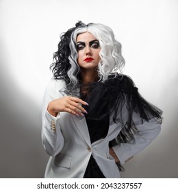 A Fatal Beauty In A Daring Fashion Image With Black And White Hair. A Rebellious Stylish Image For Halloween.