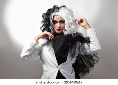A Fatal Beauty In A Daring Fashion Image With Black And White Hair. A Rebellious Stylish Image For Halloween.
