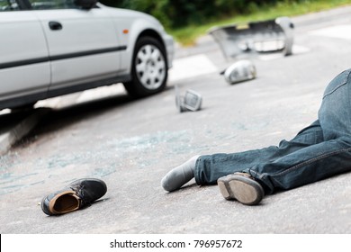 Fatal Car Accident Involving A Pedestrian. Drunk Driver Victim Lying On The Street